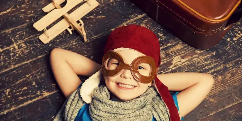 image - 2025-04-25T002427.119 A child wearing funny glasses and a hat.