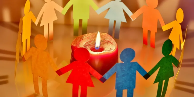rs=w_776,h_388,cg_true (6) A candle is lit in front of paper cut outs.